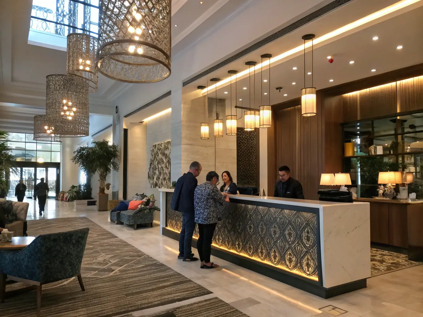 A hotel reception area with guests checking in, illustrating the hospitality sector's customer service focus.